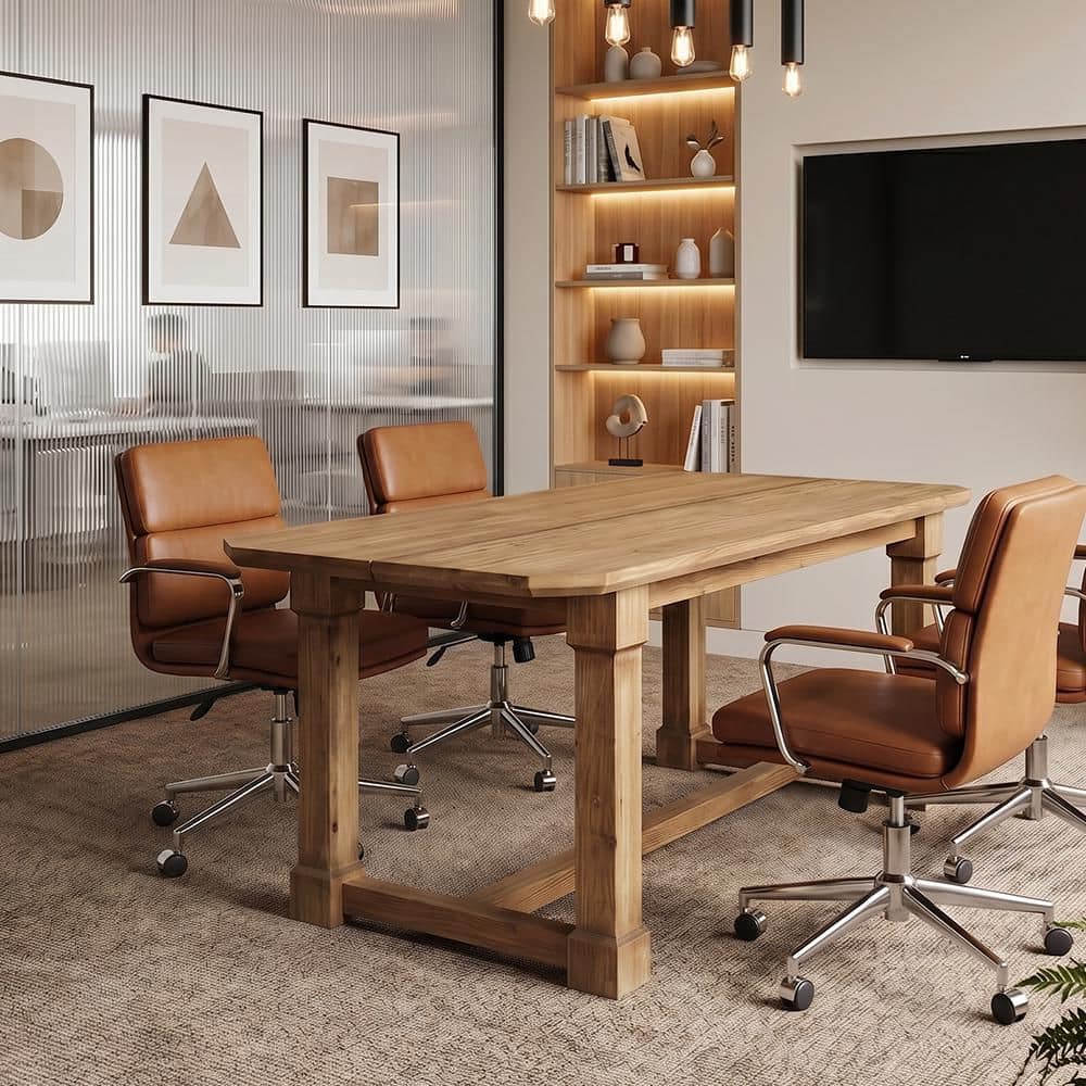 A brown wood conference table surrounded by tan leather office chairs.