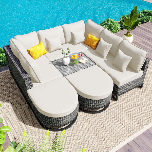 7-Piece Outdoor Wicker Conservation Sectional Set with Coffee Table and Beige Cushions for Garden and Deck