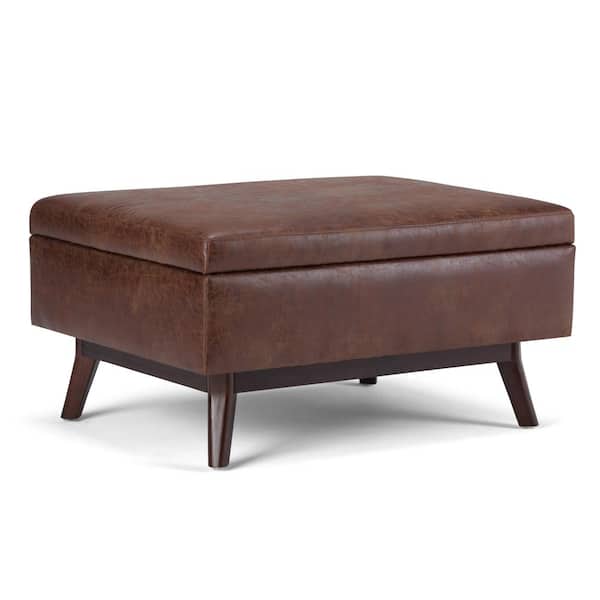 Simpli Home Owen 34 in. Mid Century Modern Storage Ottoman in Distressed Saddle Brown Faux Air Leather