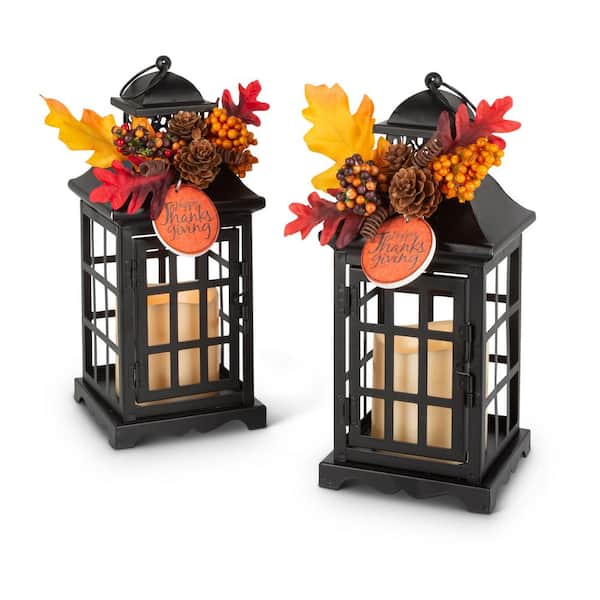 GERSON INTERNATIONAL 10.5 in. H Black Metal Lanterns with B/O LED Candles and Floral Accents (Set of 2)
