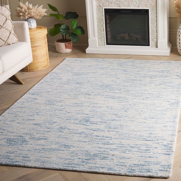 Ebony 8 ft. x 10 ft. Ivory/Light Blue Distressed Faded Area Rug
