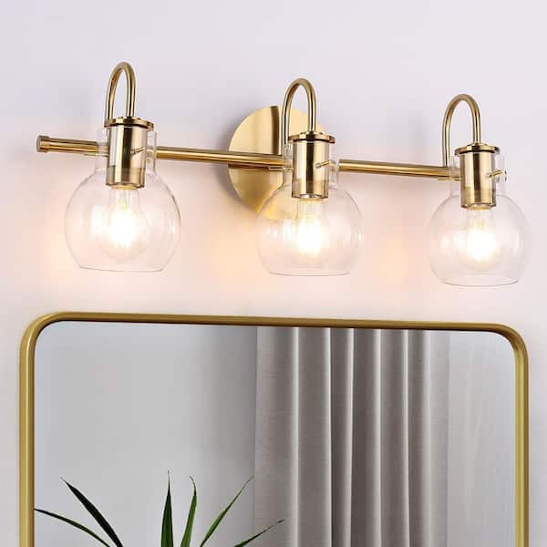 Devora 3-Light Antique Gold and Clear Glass Bath Light Devora 3-Light Antique Gold and Clear Glass Bath Light