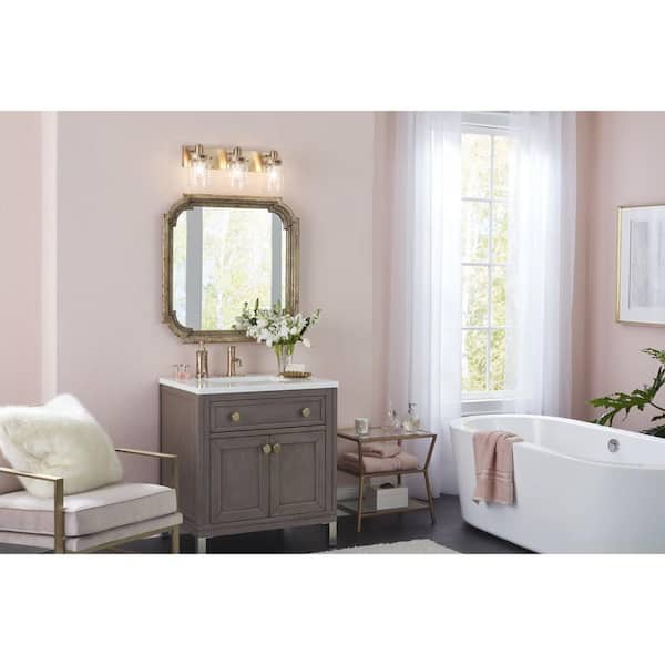 Calhoun Collection 21-5/8 in. 3-Light Gold Vintage Brass Clear Glass Farmhouse Urban Industrial Bathroom Vanity Light