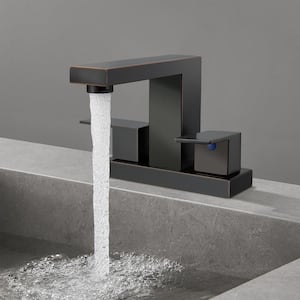 Minimalist 4 in. Centerset Double Handle Low Arc Bathroom Faucet with Drain kit Included in Oil Rubbed Bronze