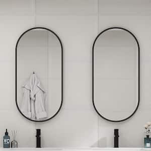18 in. W x 35 in. H Oval Aluminum Framed Wall Bathroom Vanity Mirror in Black