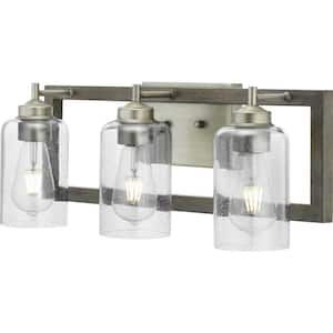 Truxel 22 in. 3-Light Antique Nickel Vanity Light with Weathered Gray Wood Accents and Clear Seeded Glass Shades