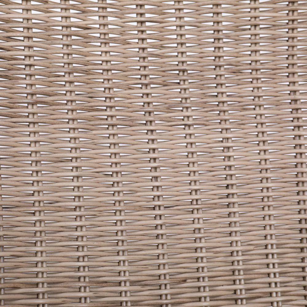Close-up texture of woven wicker material on the chair.
