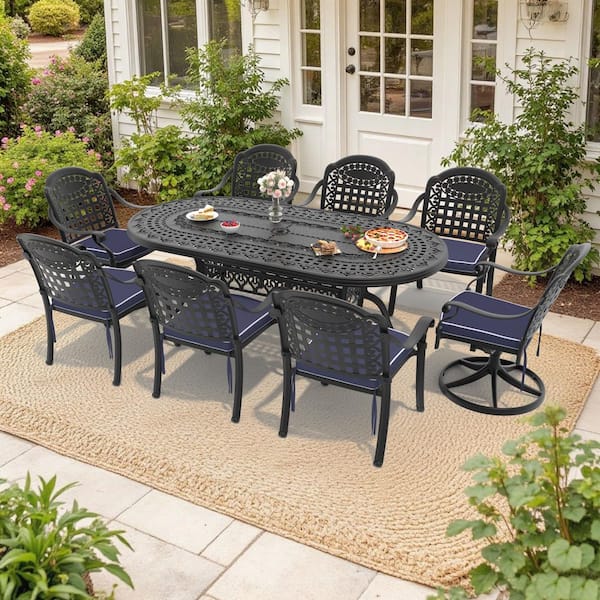 Vintage 9-Piece Cast Aluminum Outdoor Dining Set with Oval Table and Swivel Dining Chairs with Blue Cushion