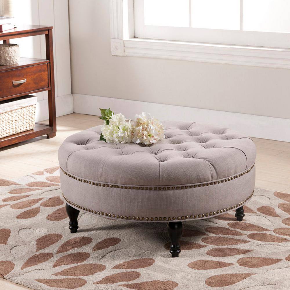 Gray Linen Tufted Round Ottoman with Brass Nailhead Trim