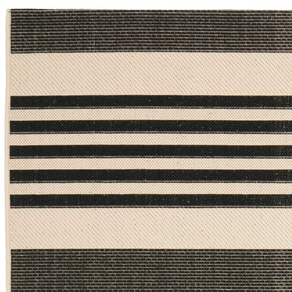 Caroline 5' x 7' Black and Beige Stripe Synthetic Area Rug