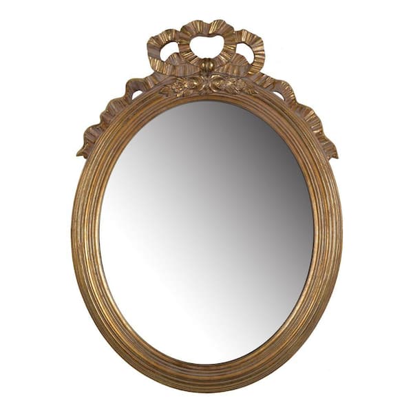 Benjara 18.5 in. W x 26 in. H Gold Ornate Polyresin Floral Crest Wall Accent Mirror