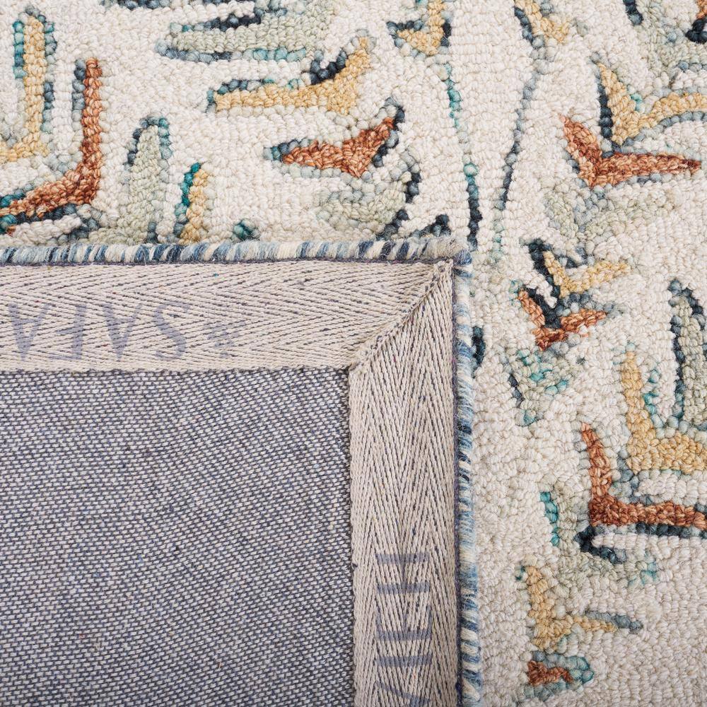Hand-Tufted Ivory and Blue Wool 6' x 9' Area Rug