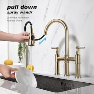 Hot and Cold Double Handle Brass Bridge Kitchen Faucet with Pull-Down Spray Head in Brushed Gold