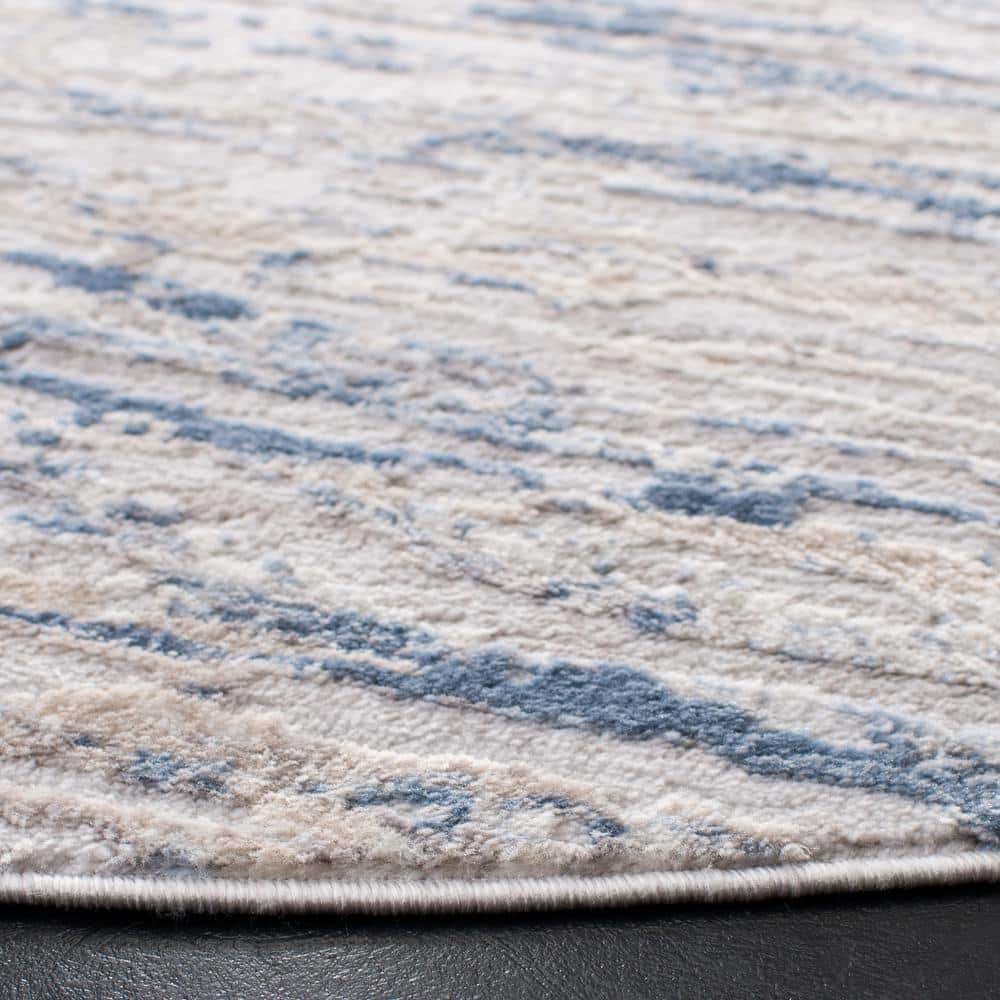 Amelia Ivory and Blue Round Synthetic Area Rug