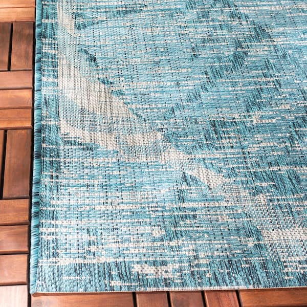 https://images.thdstatic.com/productImages/7115bcca-8b09-49aa-a120-c2c615ecbbd6/svn/gray-aqua-safavieh-outdoor-rugs-cy8556-37212-7sq-c3_600.jpg