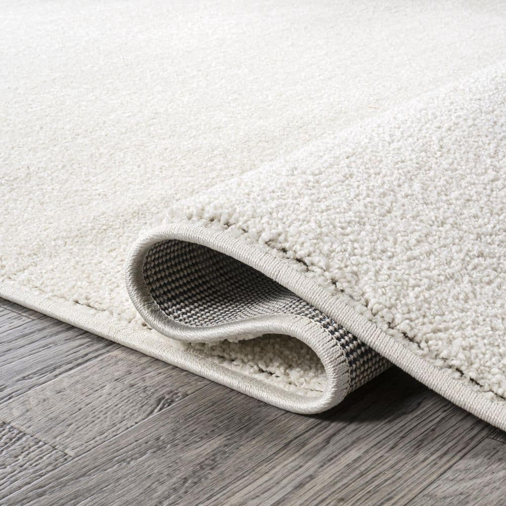 Cream Oval Low-Pile Synthetic Indoor Area Rug