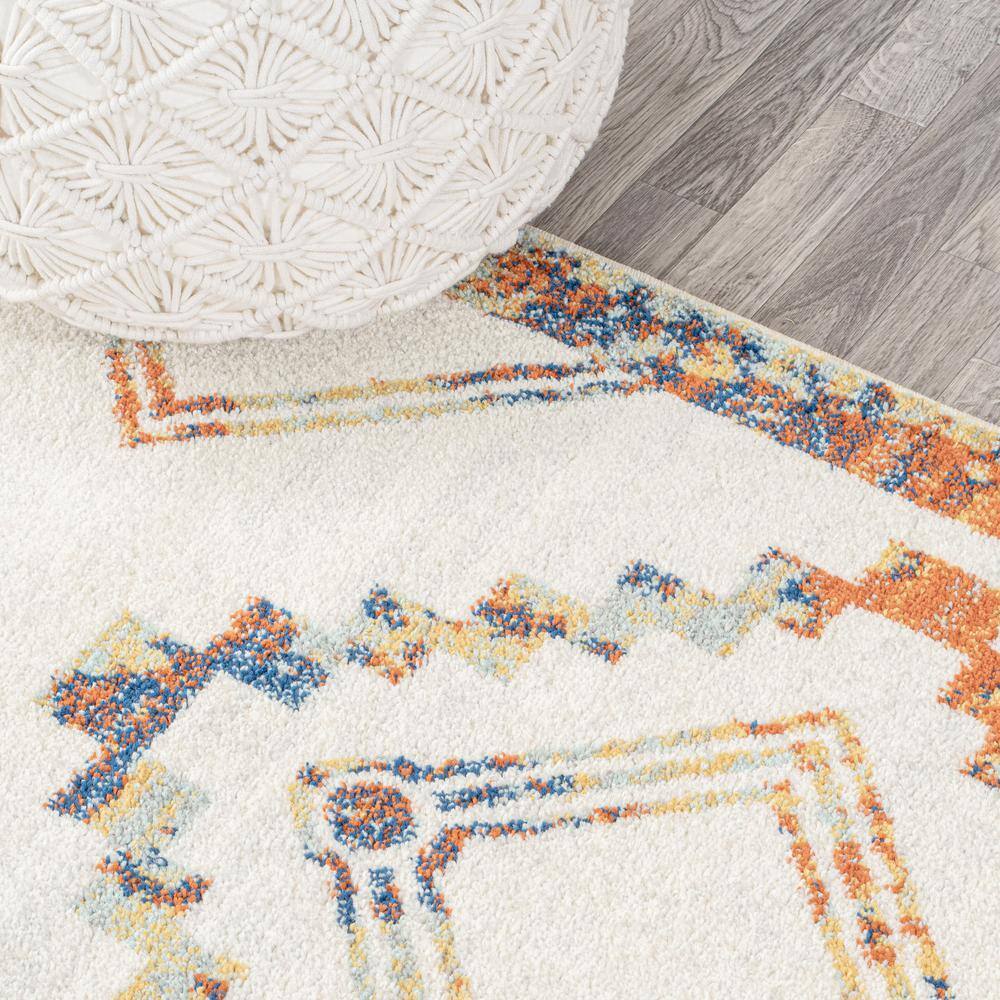 Ivory and Blue Geometric 8' x 10' Synthetic Area Rug