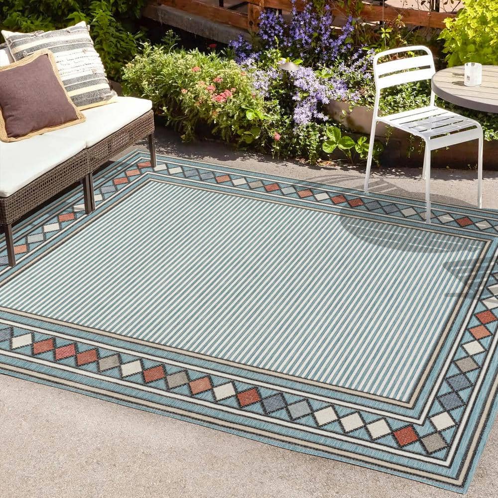 https://images.thdstatic.com/productImages/71cdf880-5722-4463-a733-464817a8edfb/svn/blue-ivory-jonathan-y-outdoor-rugs-hwc102d-3-64_1000.jpg