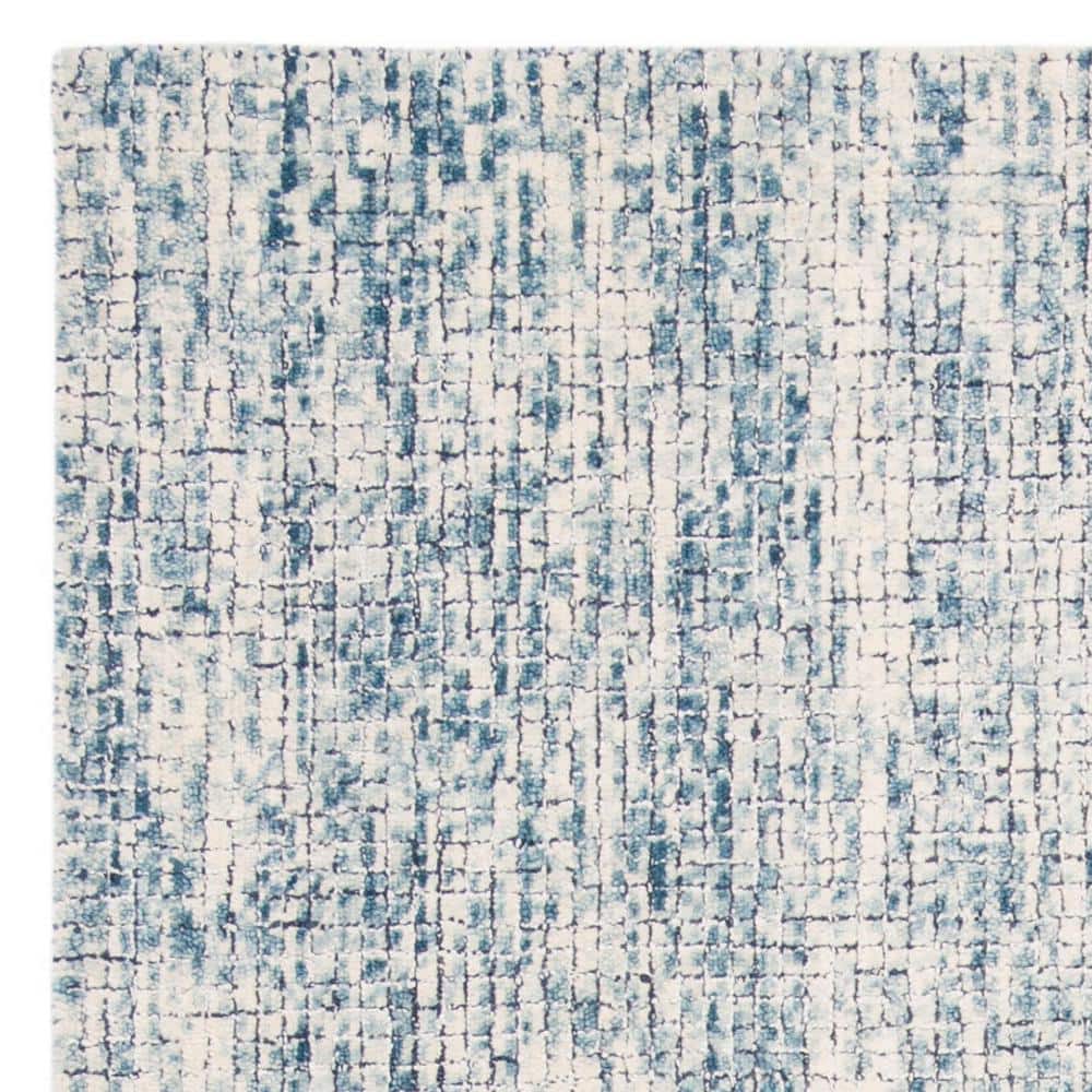 Handmade Ivory Wool Abstract Tufted Area Rug 6' x 9'