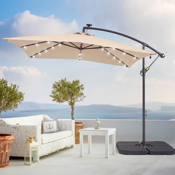 Sonkuki 8.2 ft. x 8.2 ft. Solar LED Lighted Square Patio Cantilever Umbrella With a Base in Sand
