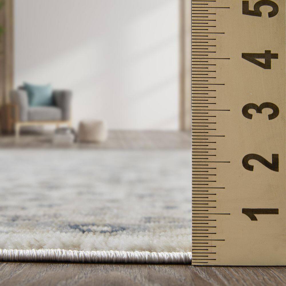 Blue Blossom Border 9' x 12' Synthetic Easy-Care Area Rug