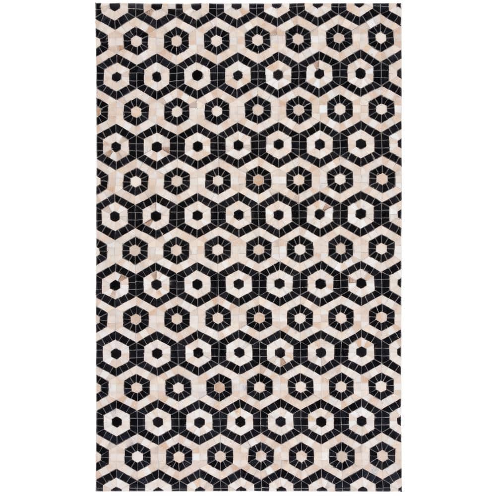 Handmade Black and Beige Geometric Cowhide Area Rug
