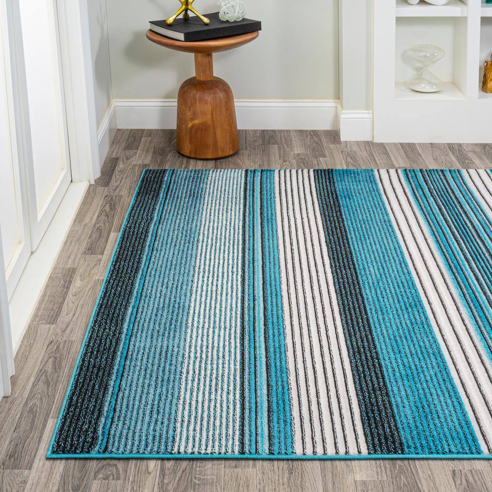 5' x 8' Blue and Navy Gradient Striped Synthetic Area Rug