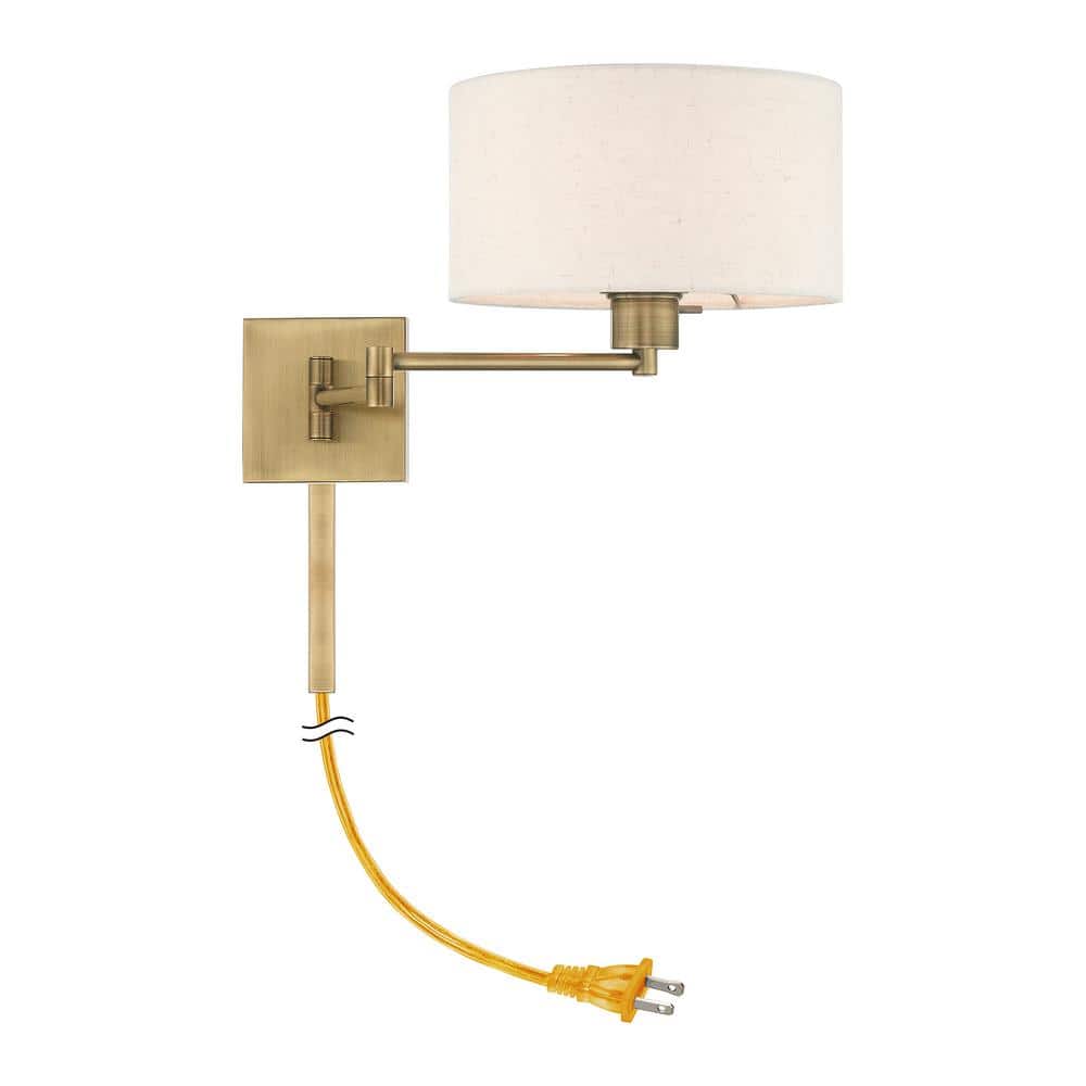 Antique Brass Swing Arm Wall Lamp with Oatmeal Shade