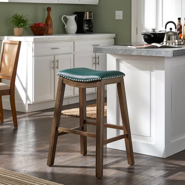 HomeSullivan 30.2 in. Green Faux Leather Saddle Seat Backless Wood Frame Bar Height Stool