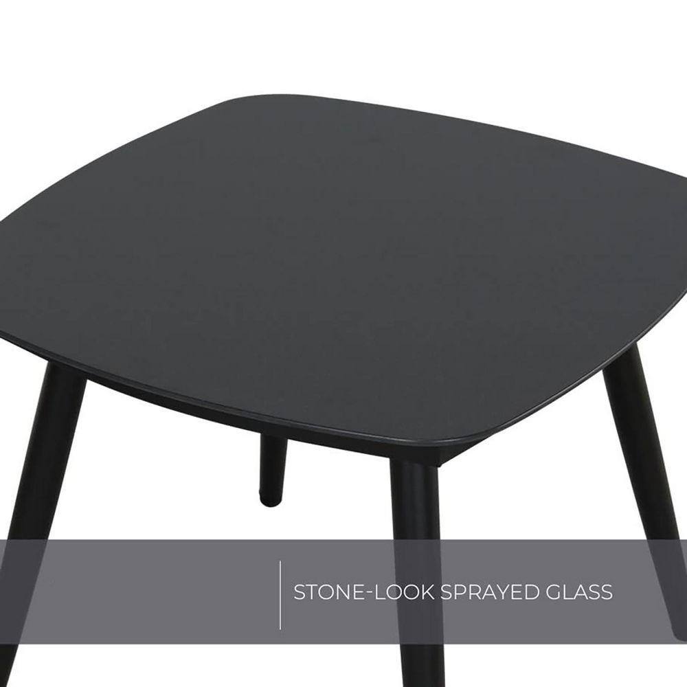 Close-up of the black stone-look sprayed glass tabletop.