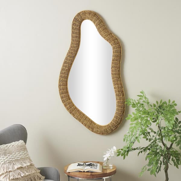 Litton Lane 53 in. H x 28 in. W. Handmade Woven Oval Framed Brown Abstract Wall Mirror