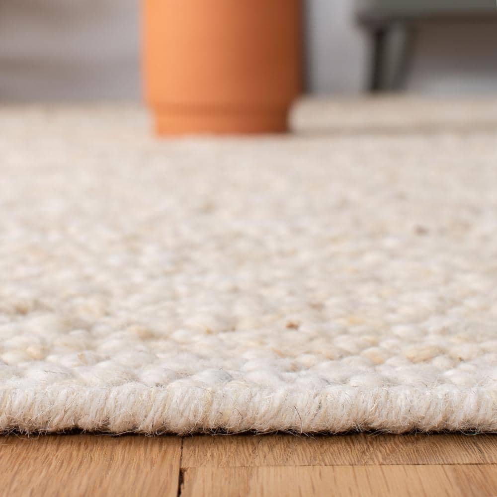 Ivory Handwoven Wool Rectangular Area Rug 5' x 8'