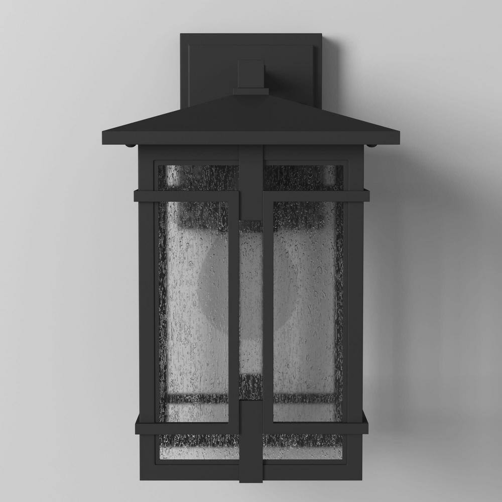 Tucker Museum Black Dimmable Outdoor Wall Sconce with Clear Seedy Glass