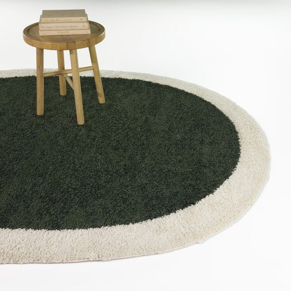 Odelle Green 5 ft. 3 in. x 6 ft. 11 in. Oval Solid Border Area Rug