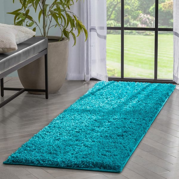 https://images.thdstatic.com/productImages/7387f510-0044-432a-94bd-050247e291f3/svn/teal-well-woven-area-rugs-ell-16-2-c3_600.jpg