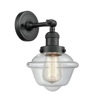 Franklin Restoration Small Oxford 7.5 in. 1-Light Matte Black Wall Sconce with Clear Glass Shade