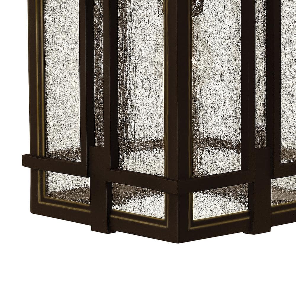 Elegant Bronze Outdoor Sconce with Clear Seedy Glass