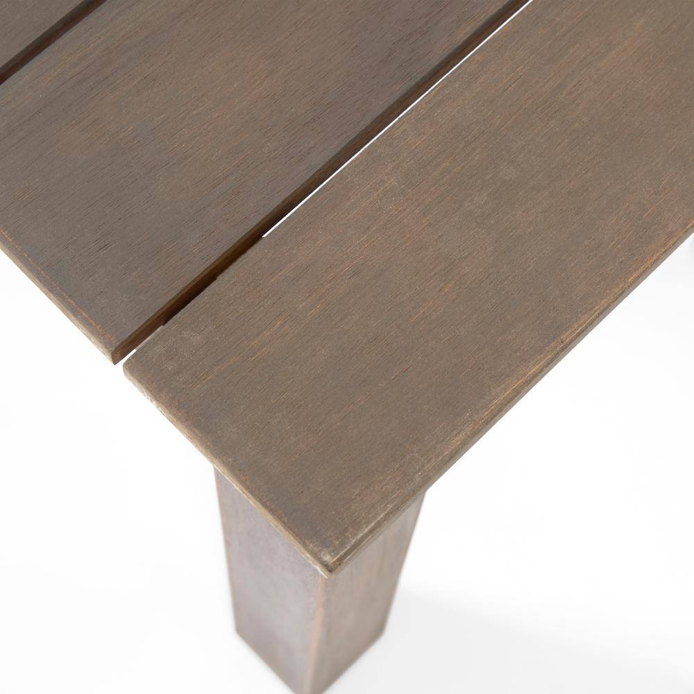 Close-up of the grey slatted wooden tabletop surface.