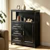 Black storage cabinet in a living room with decor.