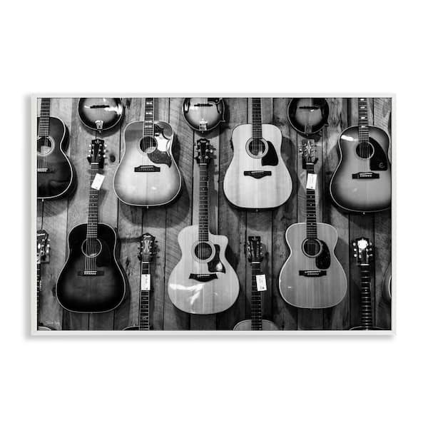 Stupell Industries Acoustic Guitars Hanging by Jennifer Rigsby White Framed Music Giclee Art Print 20 in. x 30 in.