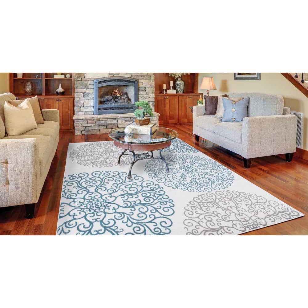 Ivory Elegance 5'3" x 7'3" Synthetic Medallion Area Rug