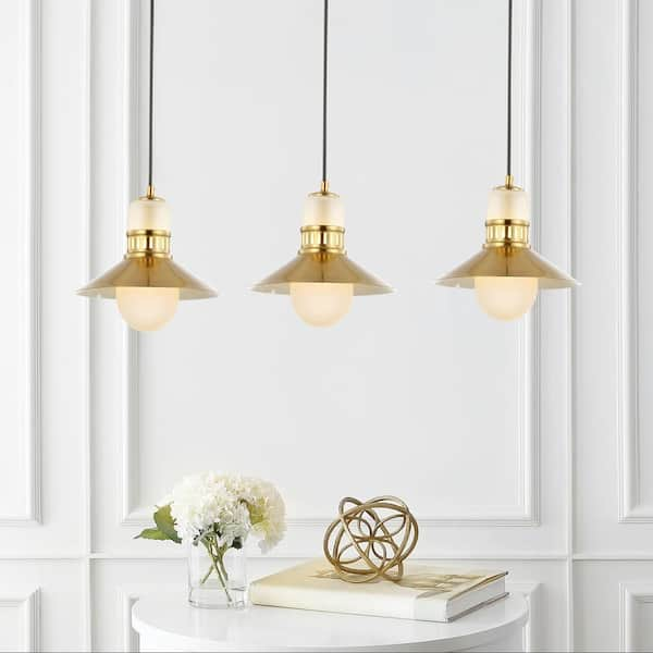 Our Watley White Cone Pendant boasts a modern and minimalistic design with  a chic brass finish on its inter…