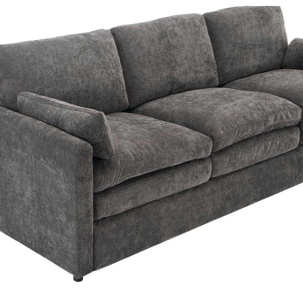 Lifestyle shot of a gray chenille loveseat.
