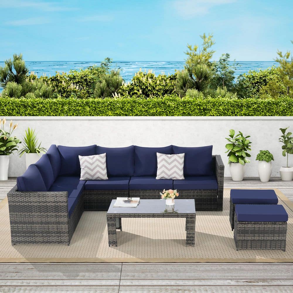 6-Piece Wicker Outdoor Sectional Set with Dark Blue Cushions and Glass Tabl