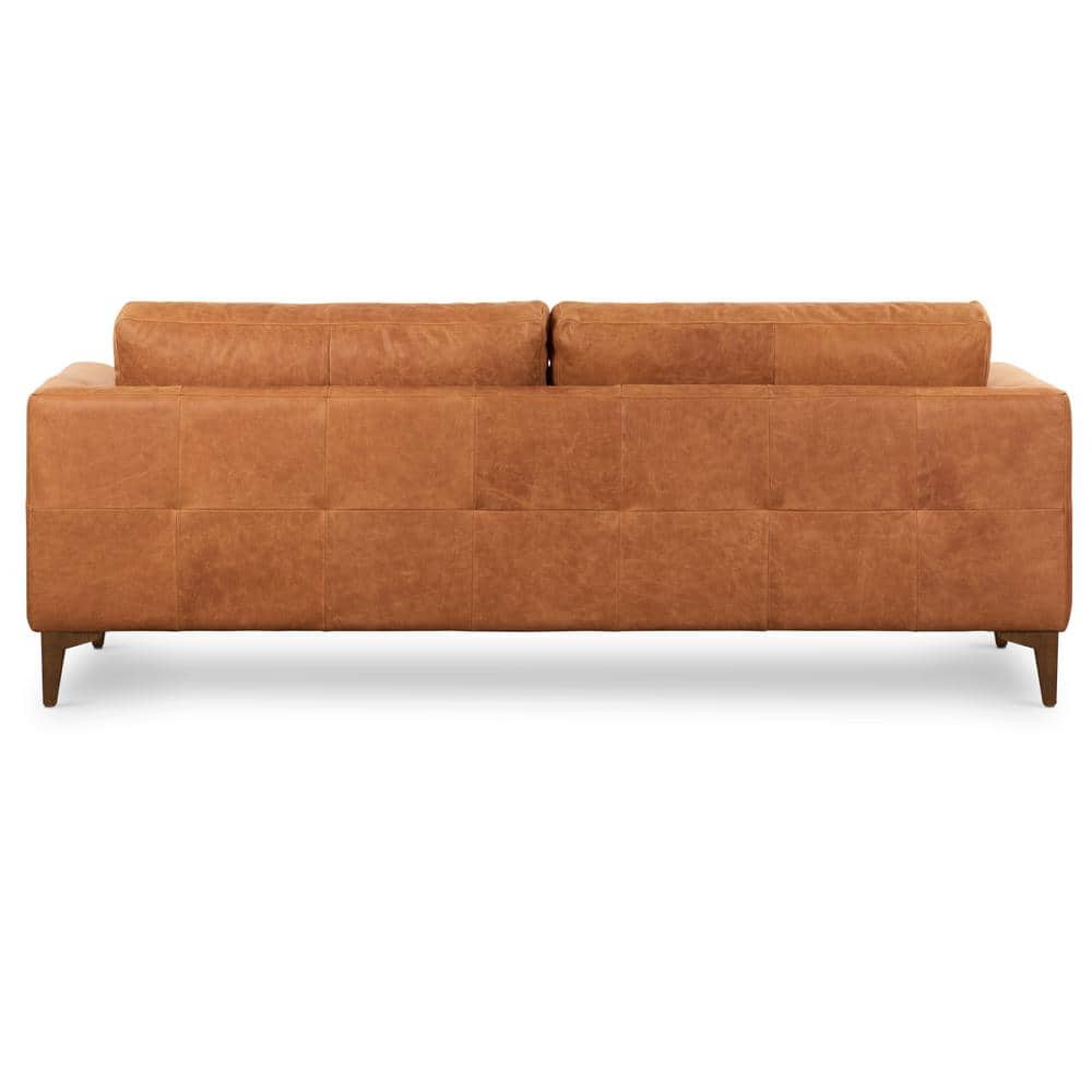 Rear view of a cognac tan leather 3-seater sofa.
