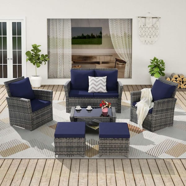 Zeus & Ruta 6-Piece Gray Wicker Outdoor Sectional Sofa Set with Dark Blue Cushions, Ottoman and 1 Tempered Glass Coffee Table