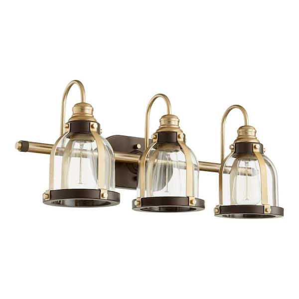 Quorum INTERNATIONAL Transitional 24.5 in. W 3-Lights Aged Brass and Oiled Bronze Vanity Light with Clear Glass