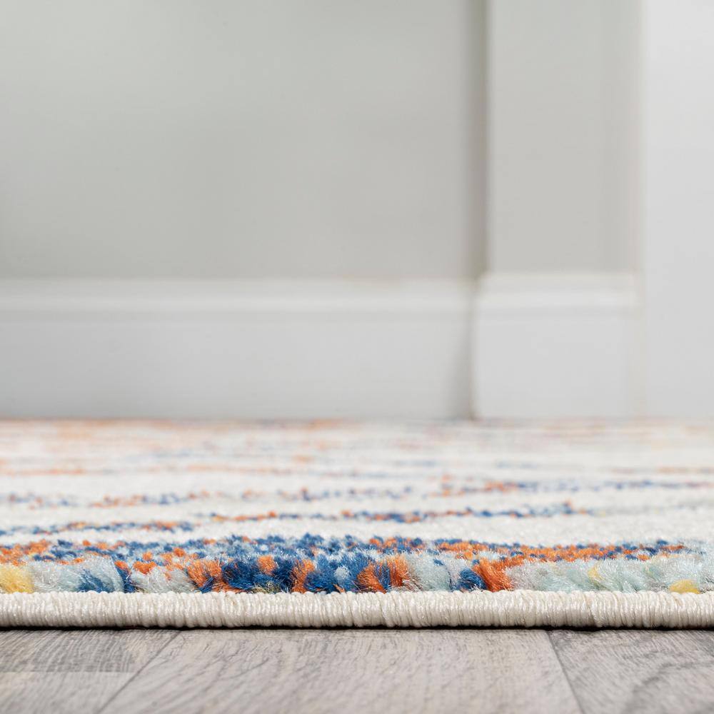 Ivory and Blue Geometric 8' x 10' Synthetic Area Rug