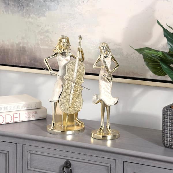 Litton Lane Gold Resin Women Musician Sculpture with Cream Pearlized Dresses and Crystal Inspired Details (Set of 2)