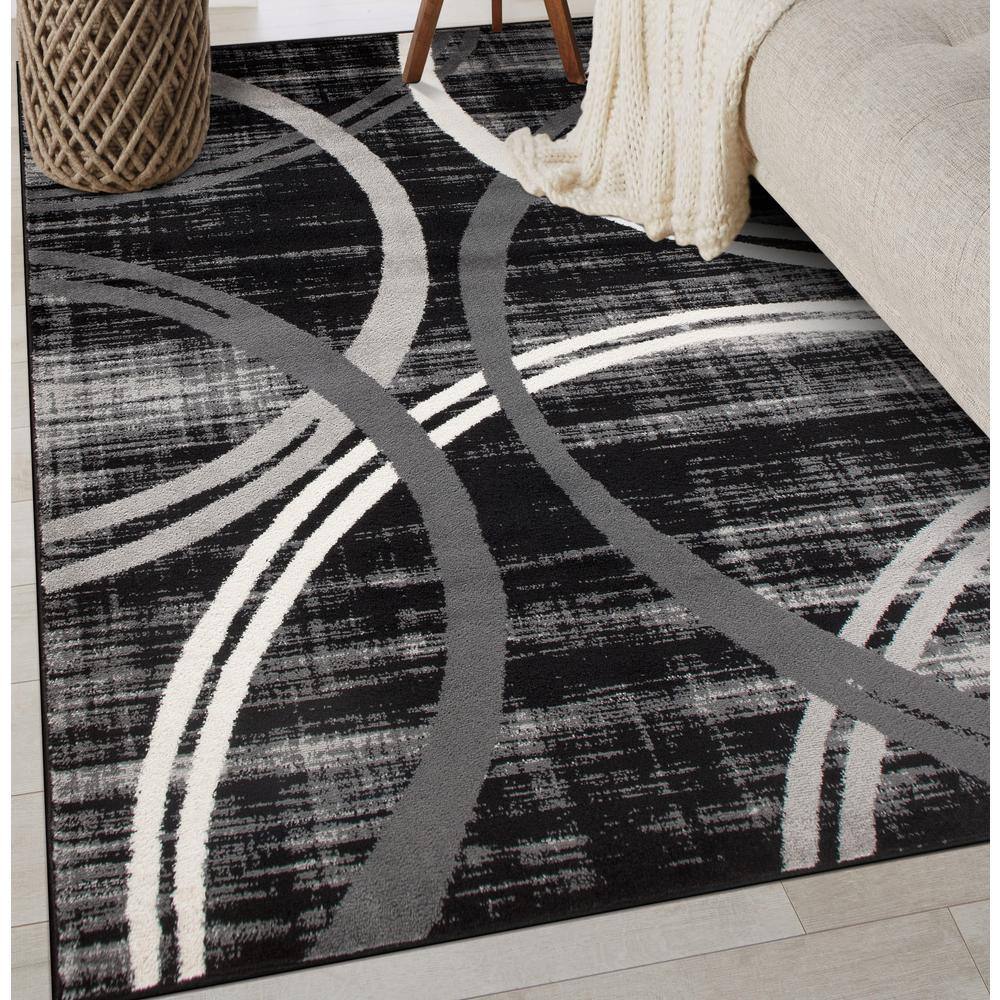 Modern Black and Gray Abstract Oval Area Rug, 5' x 7'